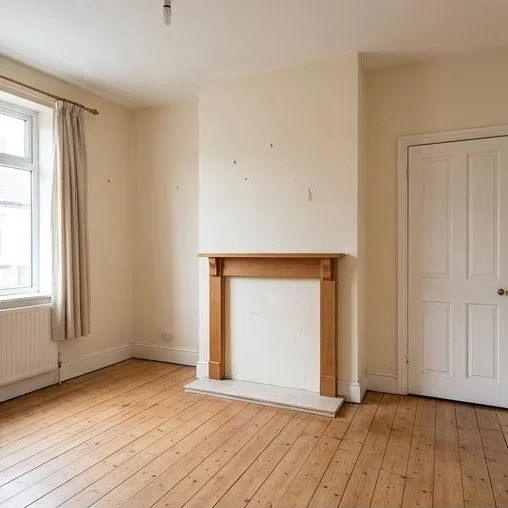 Illustrative house clearance after: the living room with loose furniture and boxes removed